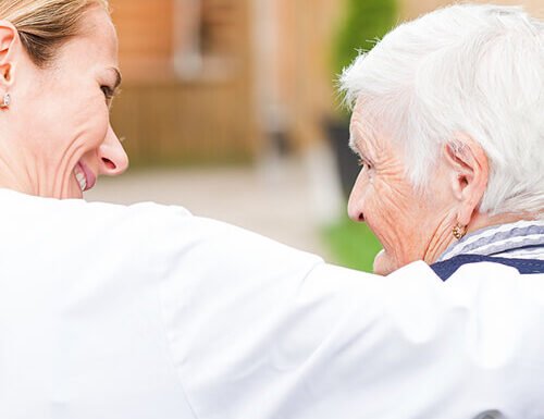 Happy patient and caregiver spending time together
